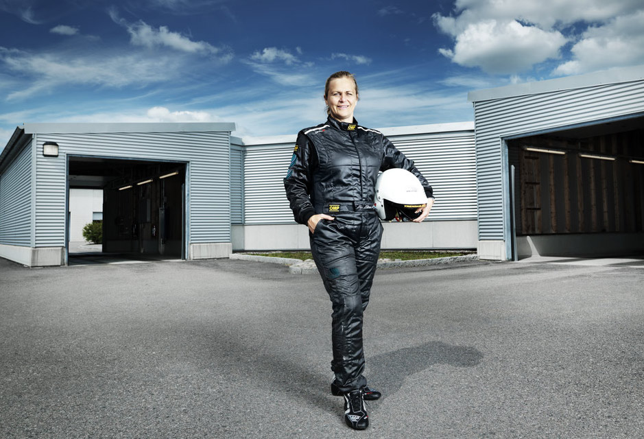 FIA SDC Race director & team leader Tina Thörner posing in motor sports outfit and helmet